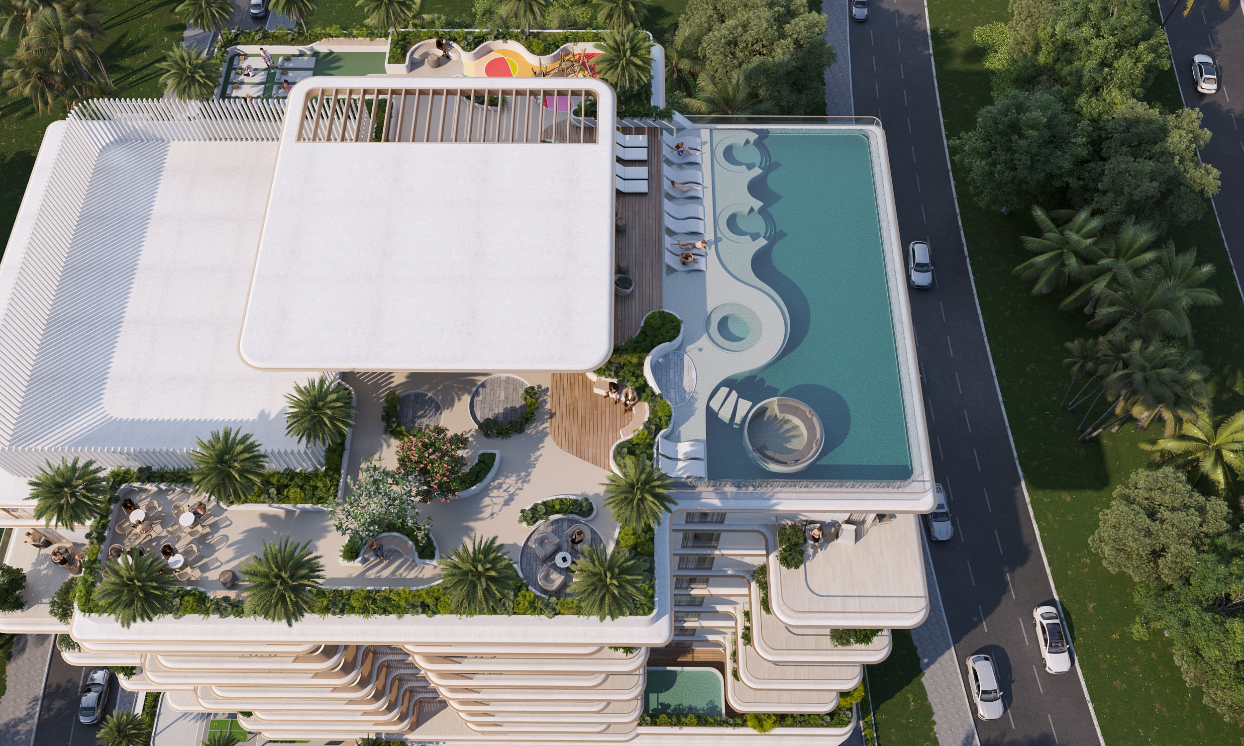 Sunset Bay 4 By Imtiaz Aerial view of a modern building featuring pools, seating areas, and lush greenery, surrounded by palm trees.